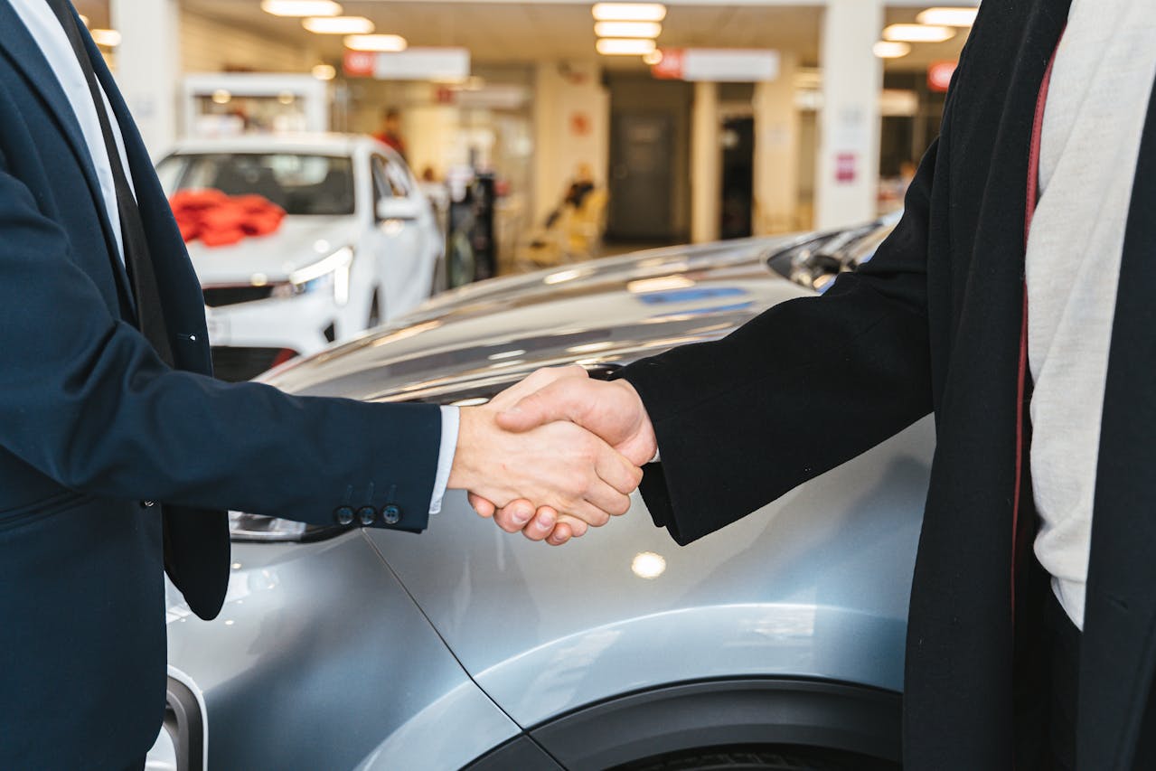 Handshake in a car dealership