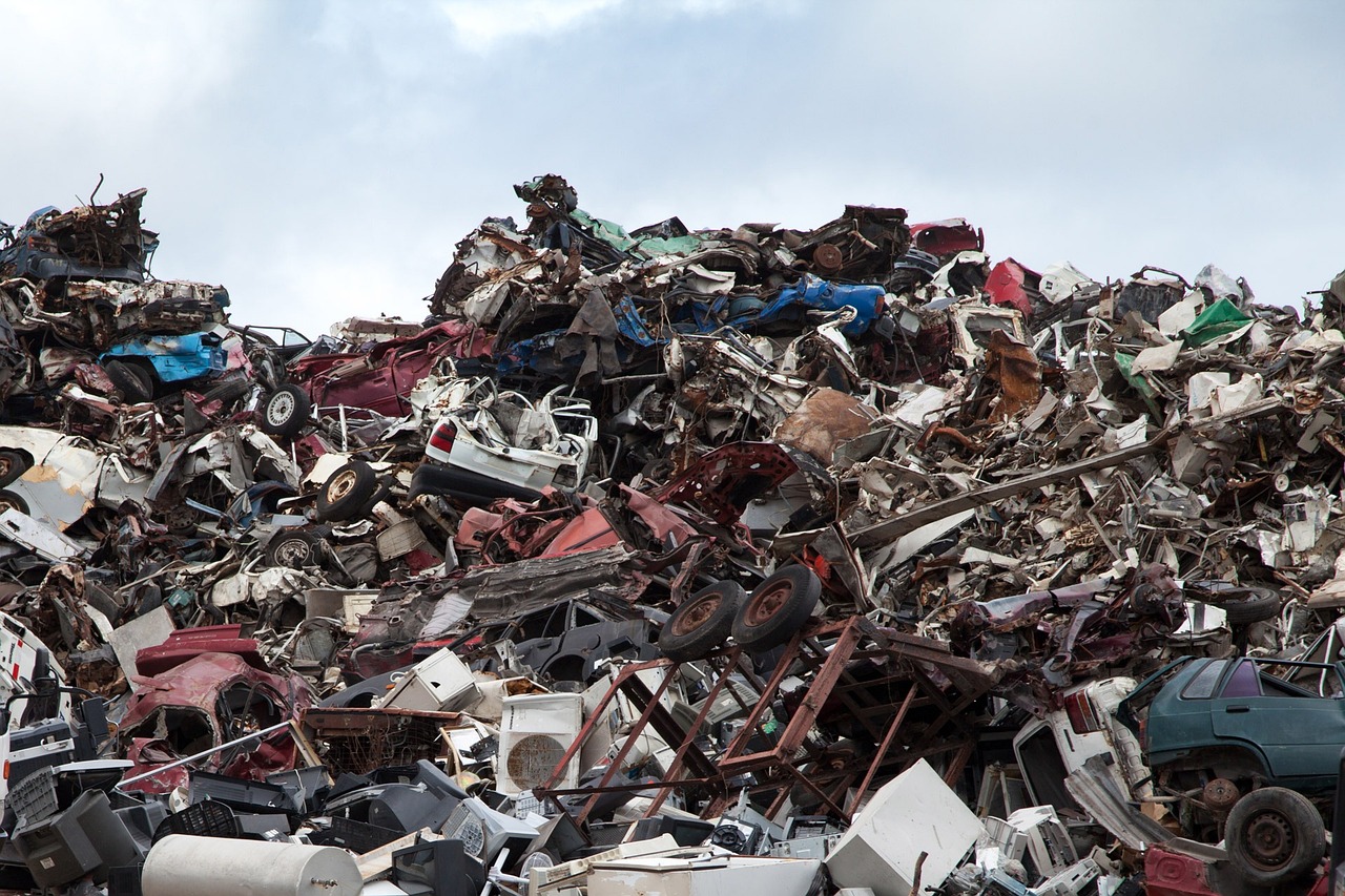 A junkyard with damaged cars