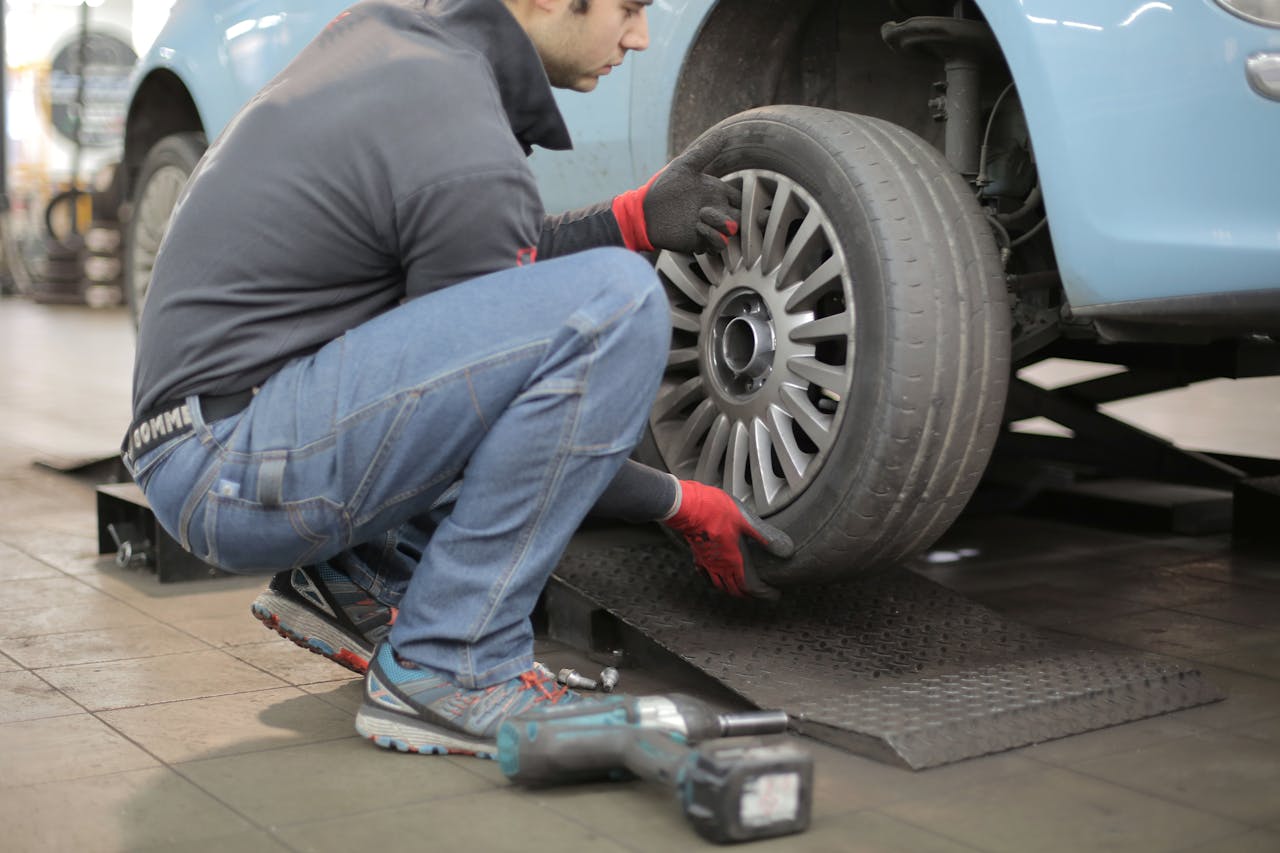 a mechanic changing car tires