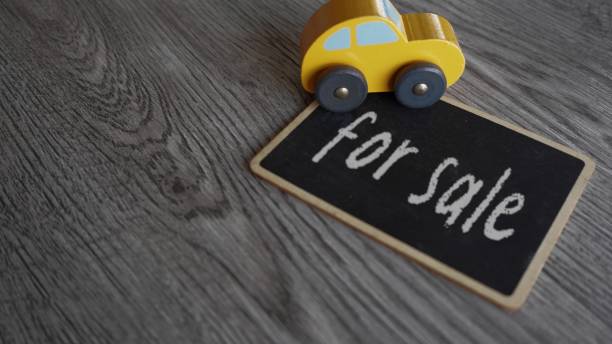 A toy car and text FOR SALE