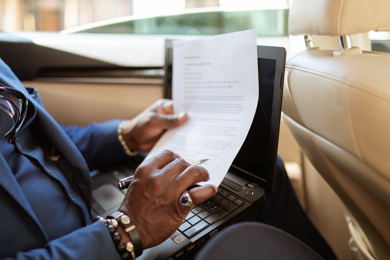 a woman reading a contract in a new car
