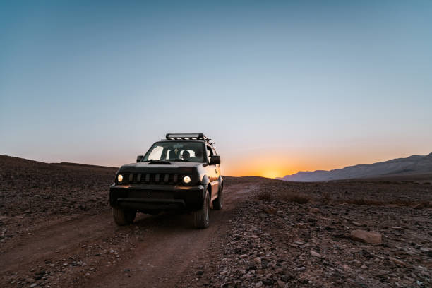 A small SUV in the desert landscape